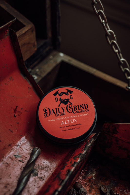 Altus Beard Balm by Daily Grind. Product sitting on a red tool chest.